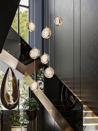 Thumbnail for Modern gold bubble staircase chandelier in luxury home, spiral K9 crystal spheres for two-story high ceiling