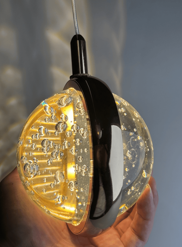 Close-up gold bubble crystal chandelier, spiral K9 sphere balls with internal bubbles for staircase high ceiling