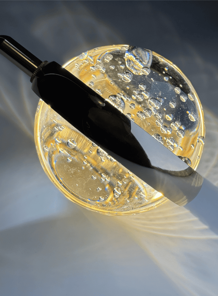 
Gold-colored bubble ball pendant light set, featuring a close-up of a single K9 crystal ball with internal bubbles, suitable for stairwells and foyers.