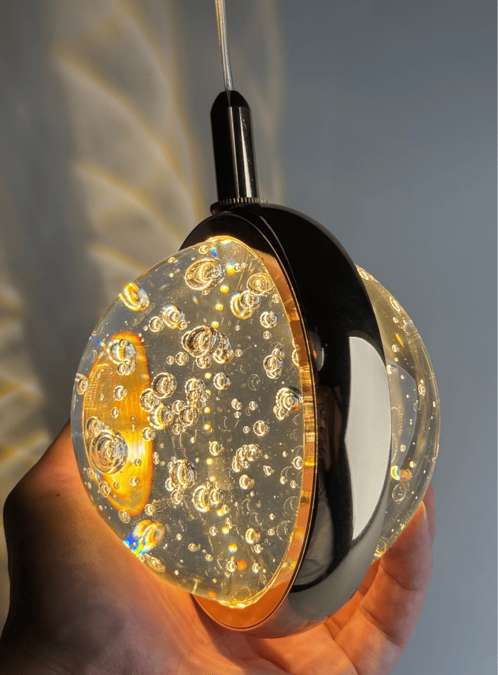 Modern gold bubble crystal chandelier, suitable for foyers, featuring a spiral design and K9 crystal spheres, ideal for high ceilings in stairwells. Detailed close-up.