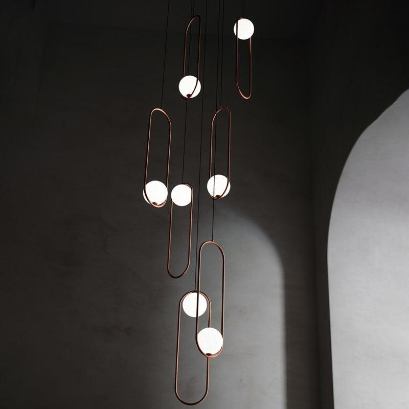 Gold 7-light staircase chandelier, frosted white glass shades for entryway stairwell lighting