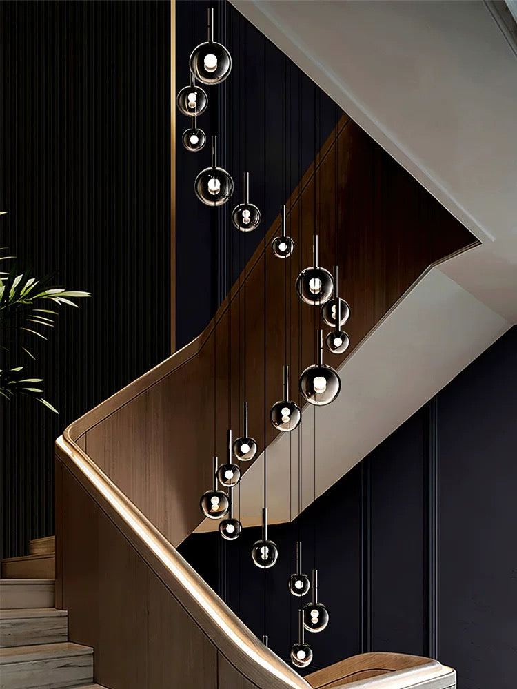 Clear blown glass ombre bubble pendant, gradient black globes in mixed sizes for staircase foyer high ceiling