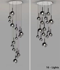 Thumbnail for 
This 16-light bubble pendant lamp features gradient black glass spheres of varying sizes, available in both random and spiral arrangements.  It is ideal for illuminating high-ceiling spaces such as stairwells and foyers.