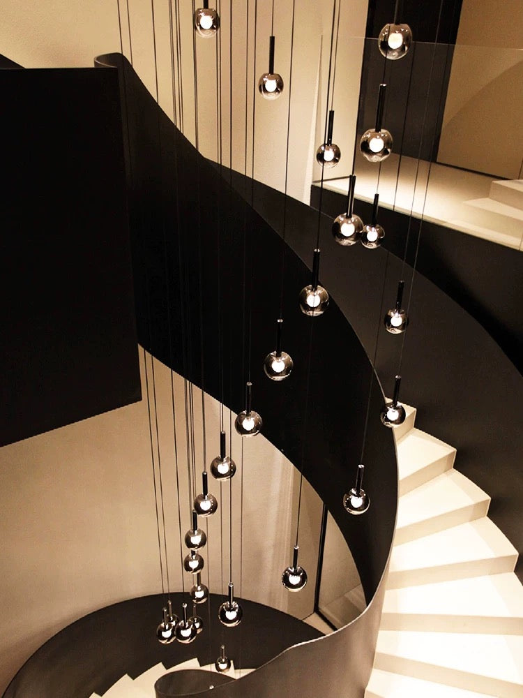 Luxury ombre glass lighting fixture for grand stairway, gradient black globes in mixed sizes for two-story foyer