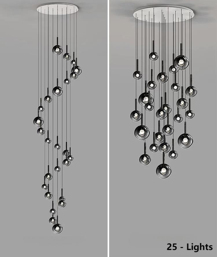 This chandelier features 25 bubble-shaped, gradient pendant lights with black gradient glass spheres of varying sizes.  Both spiral and random arrangements are available, making it suitable for lighting spaces with high ceilings such as restaurants and lobbies.