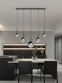 Thumbnail for Modern kitchen with pendant lights and black furniture