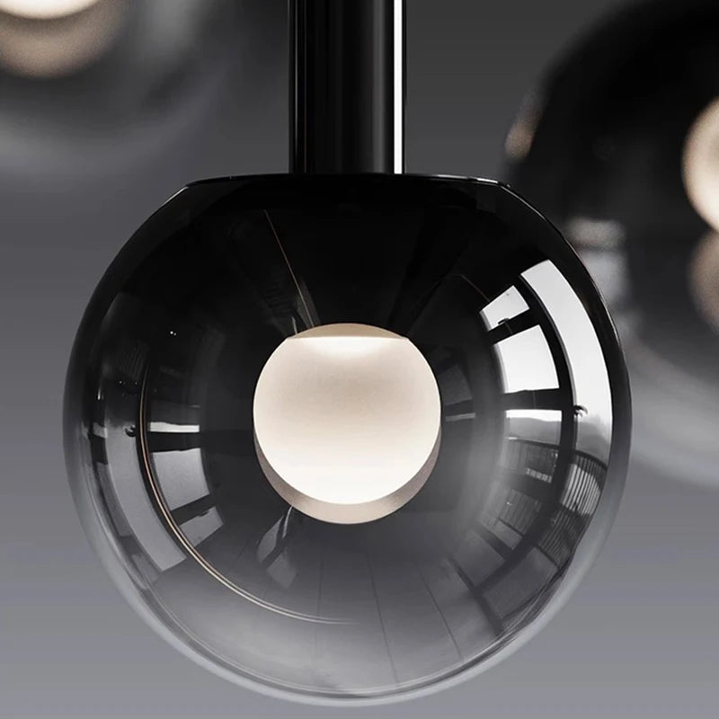 Ombre bubble glass lights, gradient black globes in mixed sizes for staircase foyer entryway two-story high ceiling