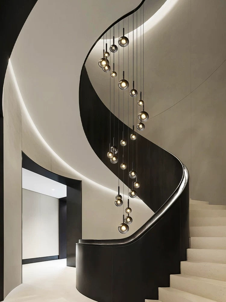 Luxury ombre glass chandelier in staircase, gradient black globes in mixed sizes for two-story foyer high ceiling
