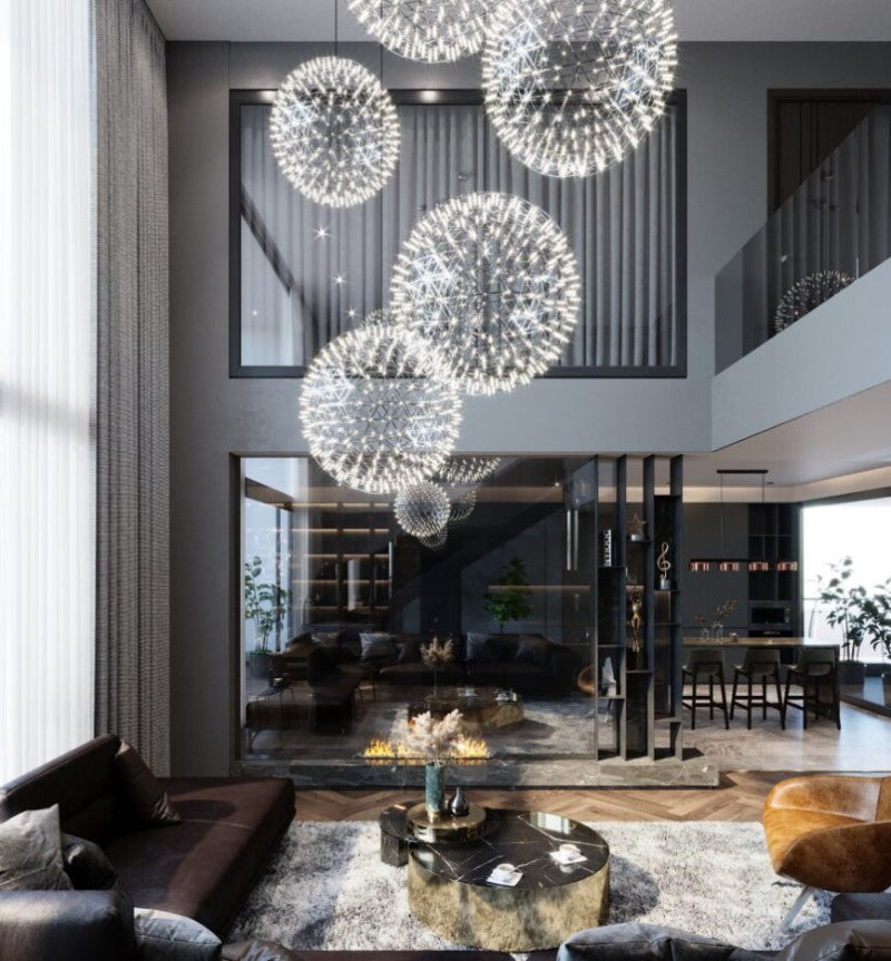 This modern LED firework chandelier for entryways features a chrome-plated starburst dandelion design and is suitable for high ceilings in foyers.