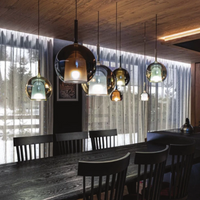 Thumbnail for This magnificent, colorful art glass staircase chandelier is composed of spheres of varying sizes, and the number of randomly arranged spheres can be customized to suit placement above a dining table.