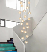 Thumbnail for Round multi-light American chandelier with precision-cut crystals creating mesmerizing display for staircase foyer entryway