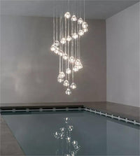 Thumbnail for Clear American bubble chandelier with adjustable suspension creating sloped ceiling compatibility for staircase foyer entryway