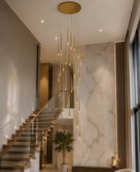 Thumbnail for Modern staircase with a gold pendant light fixture in a home interior.