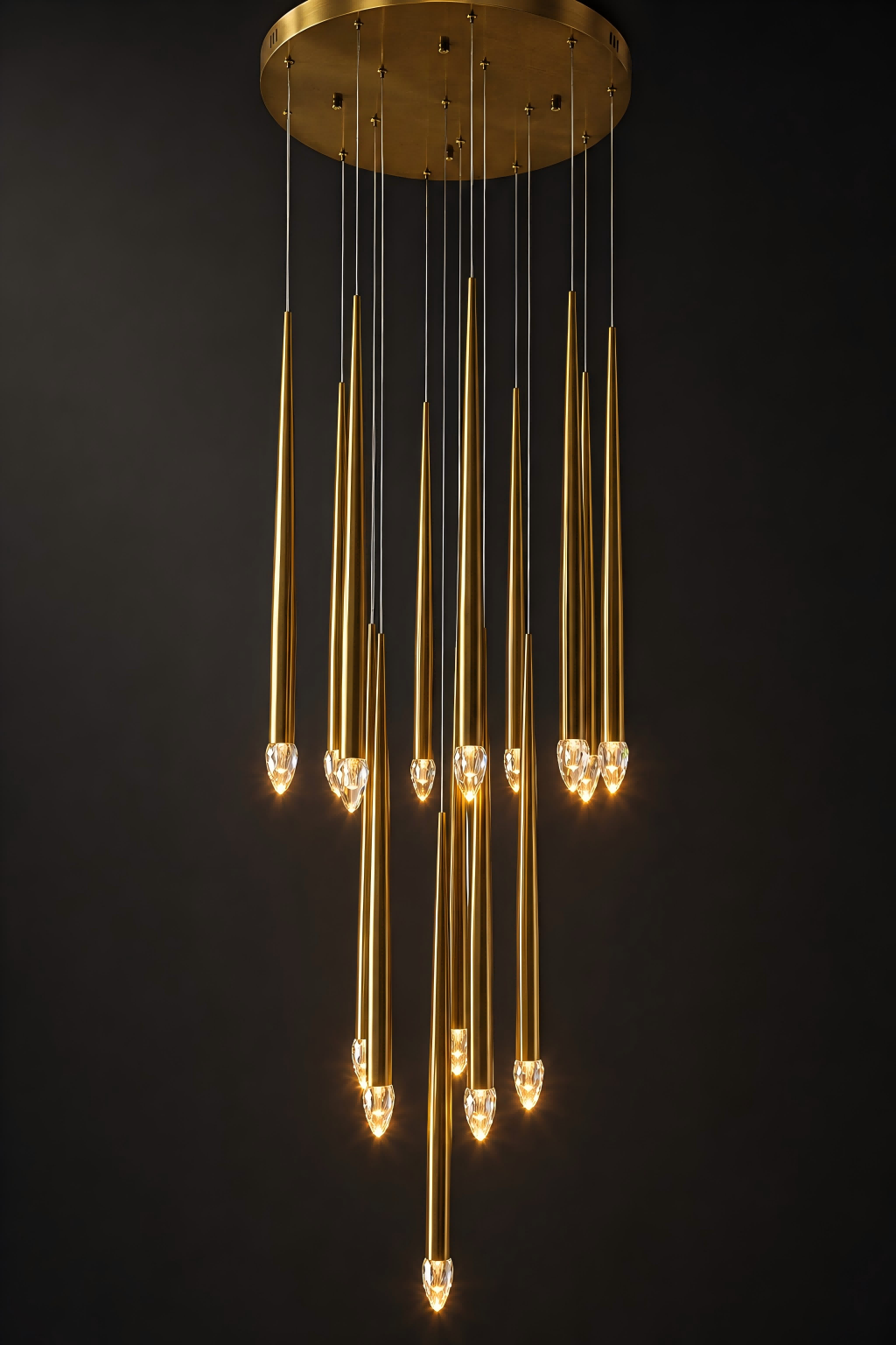 Gold pendant light fixture against a black background