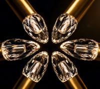 Thumbnail for Diamonds arranged in a circular pattern on gold rods with a dark background