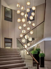 Thumbnail for Randomly arranged bubble-shaped crystal staircase chandelier, with a gold finish and K9 crystal spheres, suitable for high-ceiling areas such as entrance halls.