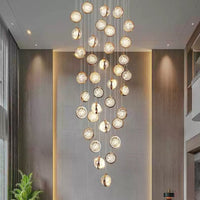 Thumbnail for Gold bubble ball chandelier cascading down stairwell, spiral K9 crystal design for high ceiling foyer lighting