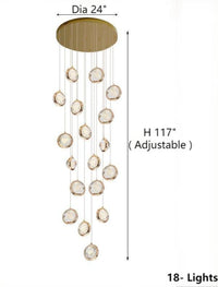 Thumbnail for This 18-light golden spiral bubble crystal chandelier, located in the grand foyer, features K9 crystal spheres and is designed for high ceilings at the staircase entrance.
