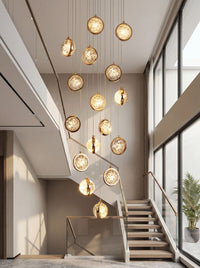 Thumbnail for Heavy durable bubble crystal chandelier with electroplated gold finish creating luxurious glow for grand staircase foyer void