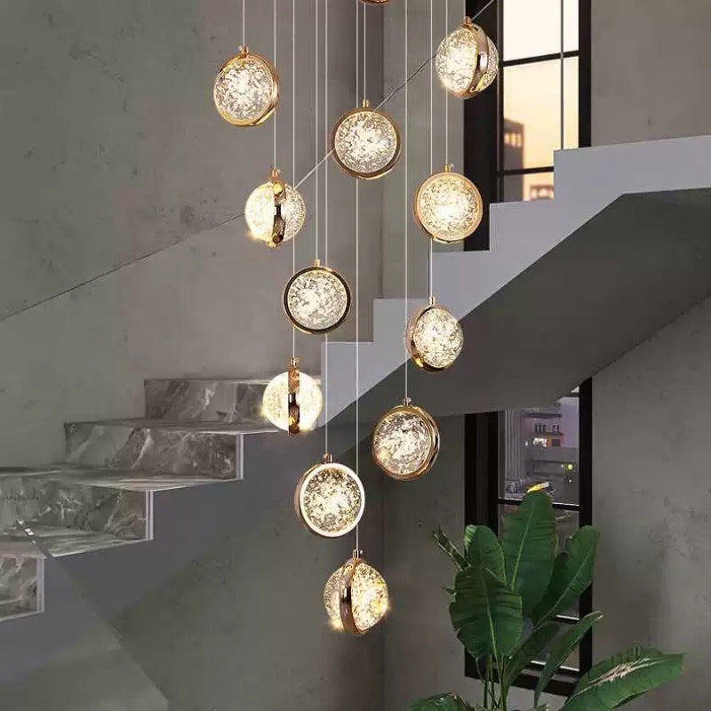 Transparent bubble ball crystal chandelier with gold spiral and random arrangement design, suitable for stairwells, foyers, entrances, and spaces with high ceilings.