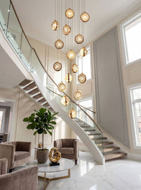 Thumbnail for Suspended bubble crystal chandelier with falling stars effect creating exquisite lighting for luxury staircase entryway foyer