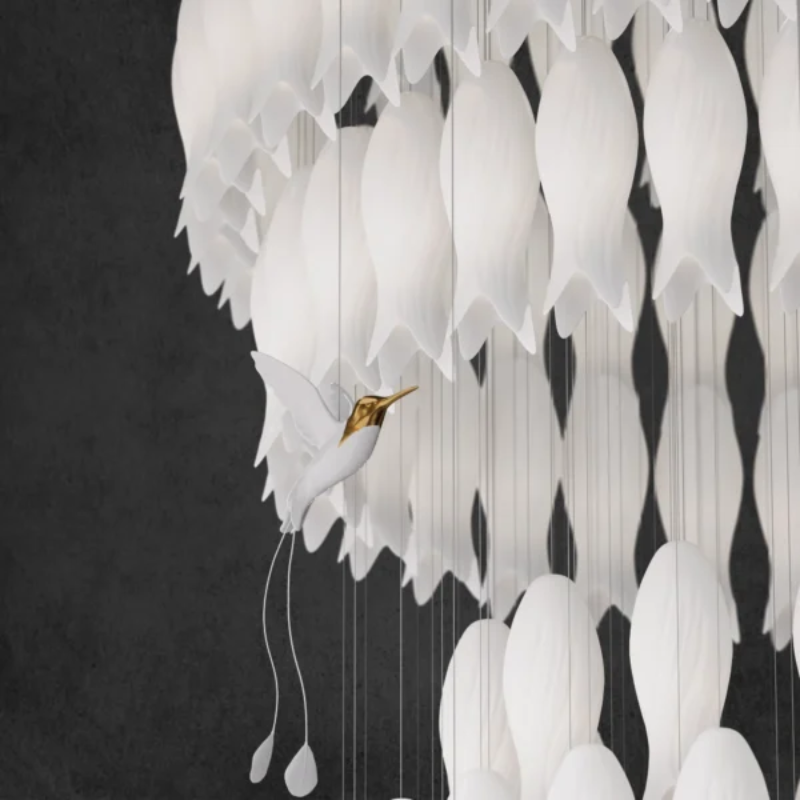 Stylish ceramic botanical lighting fixture with whimsical hummingbird elements for staircase foyer two-story ceiling