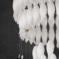 Thumbnail for Stylish ceramic botanical lighting fixture with whimsical hummingbird elements for staircase foyer two-story ceiling