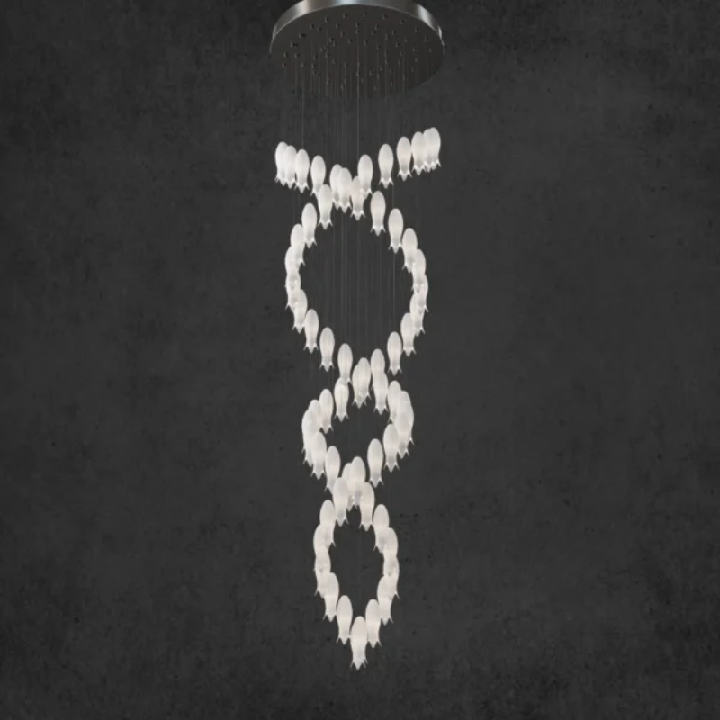 Statement ceramic petal chandelier with nature-inspired hummingbird accents creating artistic focal point for staircase,double helix arrangement