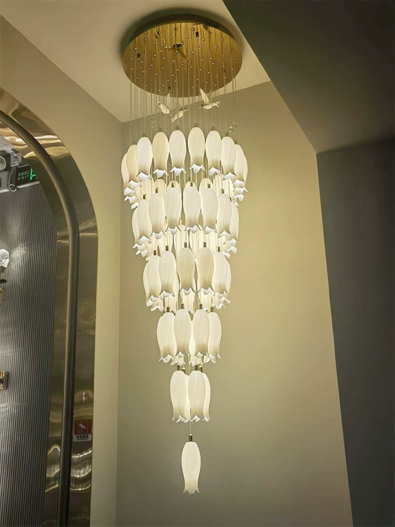 Glamorous ceramic flower chandelier adding botanical elegance with hummingbird accents to staircase foyer decor lighting