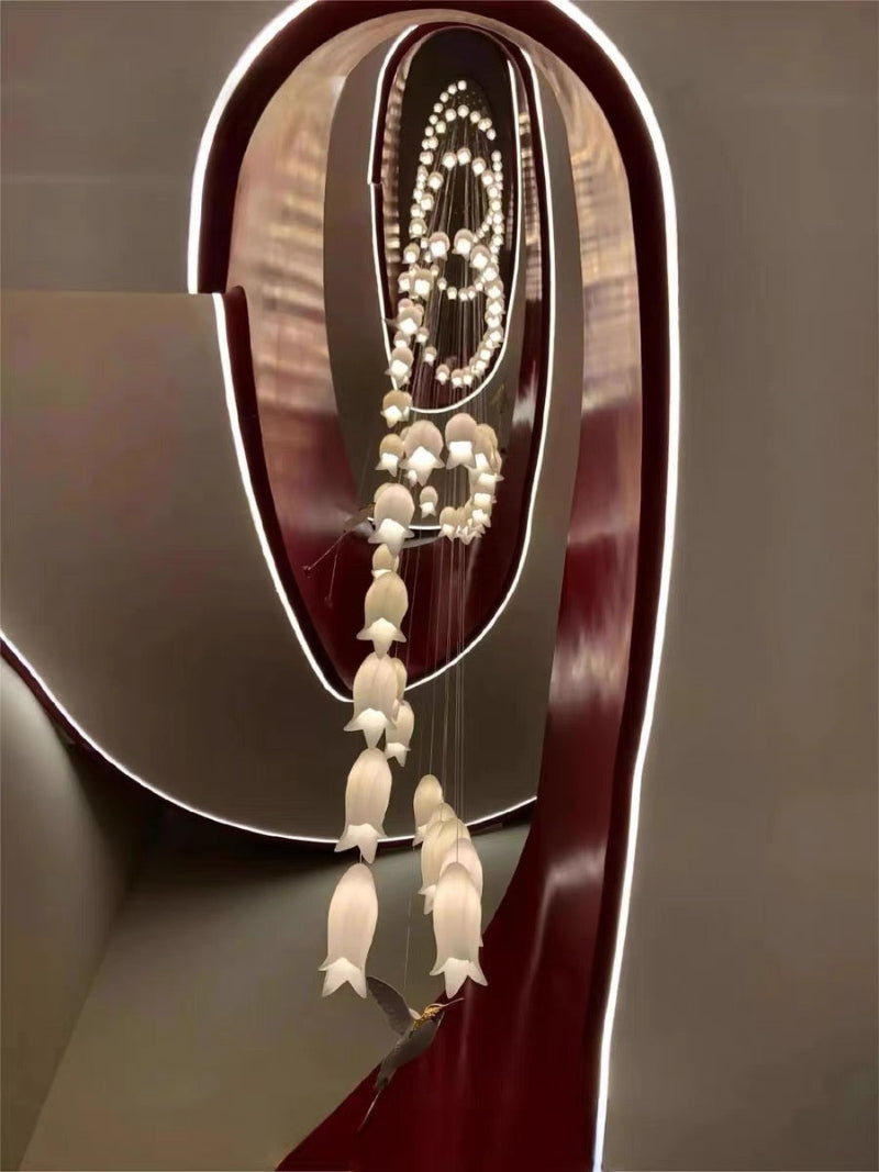 Transformative ceramic flower pendant with nature-inspired hummingbird design for luxury staircase foyer cathedral ceiling,spiral