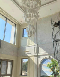 Thumbnail for Contemporary ceramic flower fixture adding botanical flair to staircase with hummingbird-inspired design for foyer