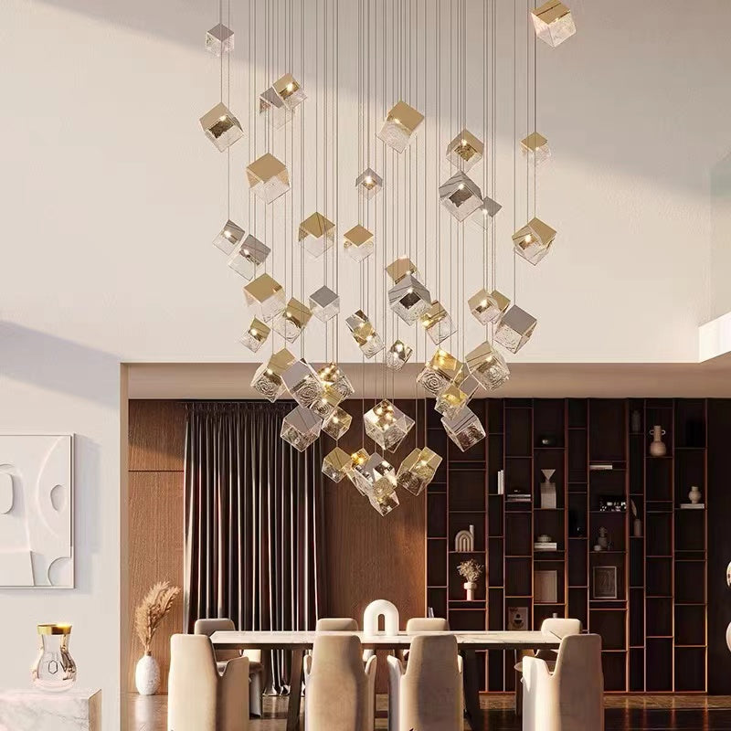 An elegant staircase chandelier with ice-cube-shaped design and textured glass pendants, featuring a rippling light effect, is suitable for dining areas with high ceilings.