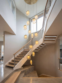 Thumbnail for Contemporary golden cascade crystal pendant light with tiered waterfall design creating brilliant sparkle in modern foyer high ceiling