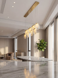 Thumbnail for Sophisticated gold cascade chandelier featuring cascading crystal layers creating waterfall lighting for modern dining room entryway