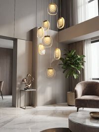 Thumbnail for Artistic gold cascade chandelier with flowing crystal tiers creating elegant waterfall effect for grand foyer staircase lighting