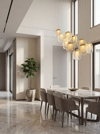 Thumbnail for Statement golden cascade crystal pendant with multi-tier waterfall design creating luxurious ambiance in hotel lobby foyer