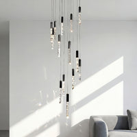 Thumbnail for Premium LED linear K9 crystal chandelier with waterfall rod design creating dramatic illumination in luxury foyer stairwell void