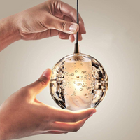 Thumbnail for Modern chrome-plated bubble crystal chandelier, suitable for foyers; dimmable LED suspended spherical light, suitable for high-ceiling areas at staircase entrances. Close-up of a single crystal element.