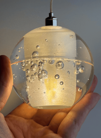 Thumbnail for An artistic chrome-plated bubble crystal chandelier with dimmable LED suspended spherical lights, suitable for stairwells, foyers, or spaces with high ceilings.  Single-head crystal warm light effect shown.