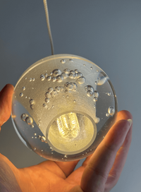 Thumbnail for Dimmable LED light source detail inside chrome bubble crystal orb showing internal structure for staircase chandelier installation