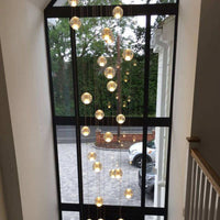 Thumbnail for Chrome hardware bubble crystal chandelier with warm dimmable LED floating orbs creating ambient glow for modern foyer stairwell