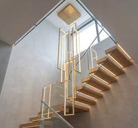 Thumbnail for Statement gold geometric LED chandelier featuring minimalist interlocking rectangles creating brilliant illumination in contemporary staircase void