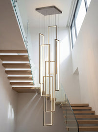 Thumbnail for Contemporary gold geometric LED chandelier with minimalist interlocking rectangles creating sculptural lighting in modern two-story foyer staircase