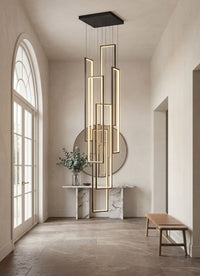 Thumbnail for Artistic black geometric LED chandelier with minimalist interlocking rectangles creating dramatic lighting installation in modern high ceiling foyer