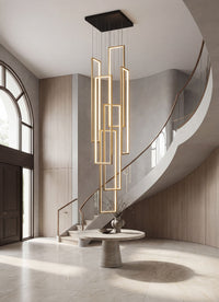 Thumbnail for Designer geometric LED chandelier with gold minimalist interlocking rectangles creating elegant ambient lighting in luxury residential stairwell