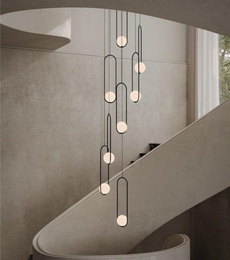 Black 8-light staircase chandelier, random hanging design, frosted white glass, warm LED lighting