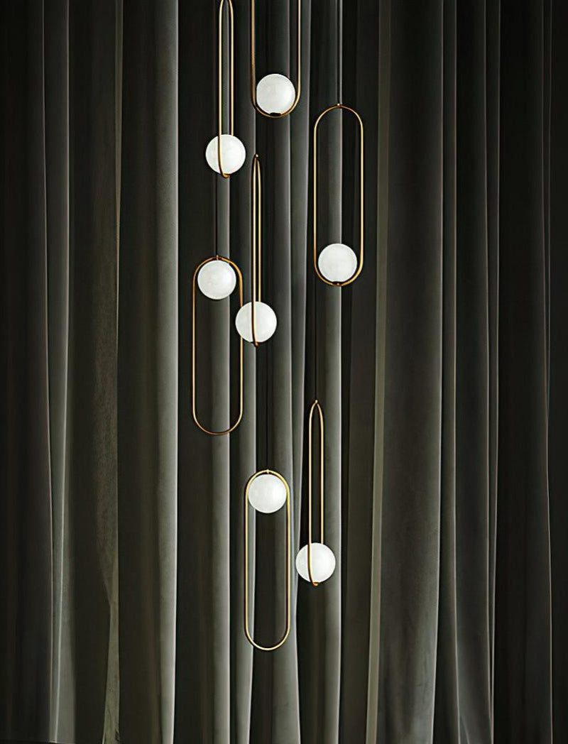 Gold 7-light glass globe chandelier creating elegant lighting for staircase foyer entryway high ceiling installation