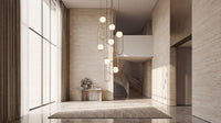 Thumbnail for Statement glass globe chandelier with cascading pendants creating brilliant ambient lighting in luxury residential stairwell entryway