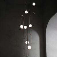 Thumbnail for Gold 7-light glass globe staircase chandelier with frosted white glass shades for entryway stairwell high ceiling lighting