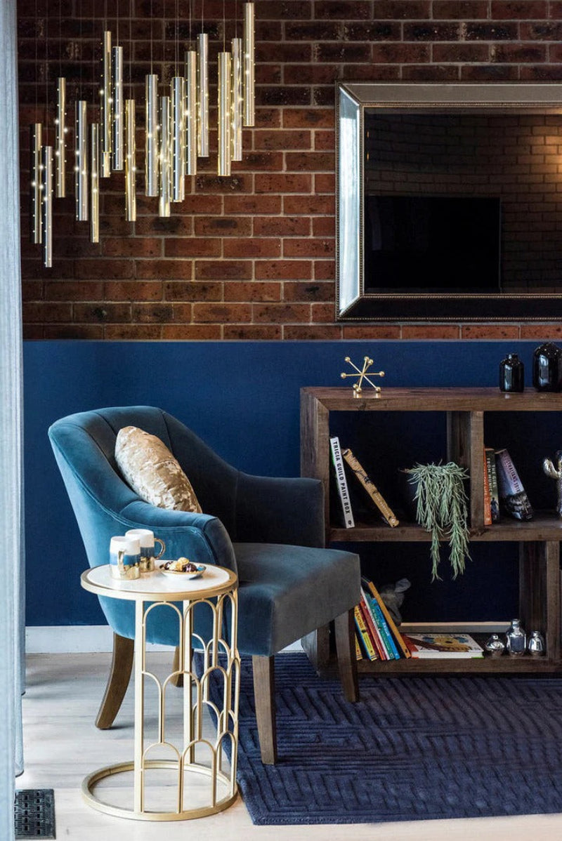 Modern minimalist linear cylinder pendant with golden meteor shower design and perforated tubes for ambient lighting 4-42 lights